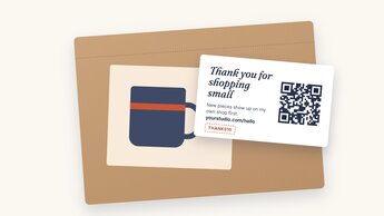 A small thank-you card with a QR code tucked into a kraft mailer next to a handmade mug